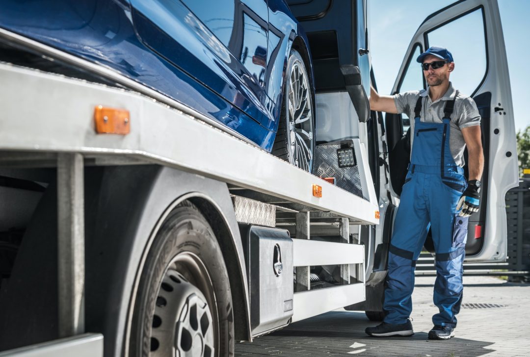 Repo company driver towing repossessed vehicle